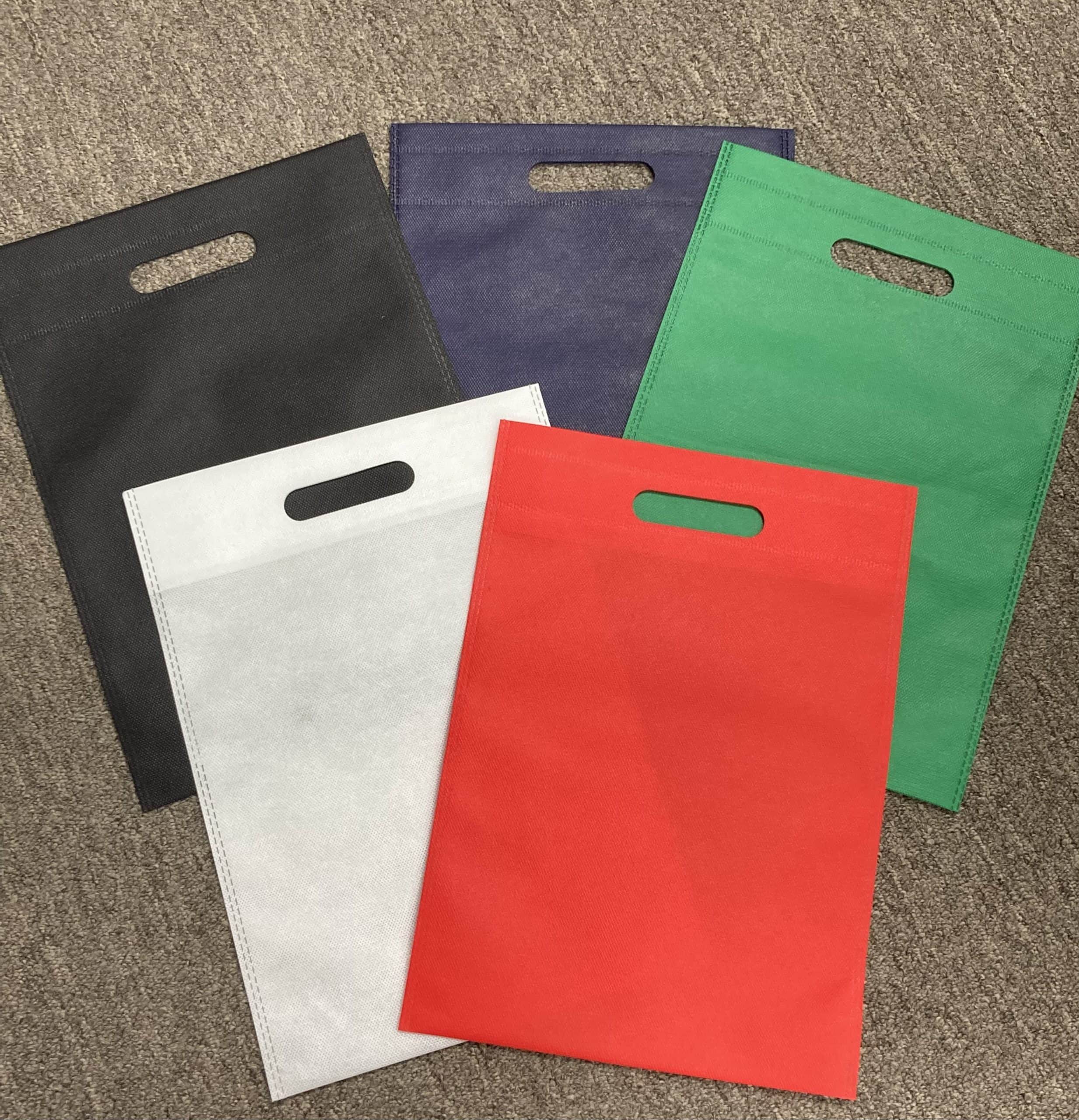 10 x 14″ 80 gsm Non Woven Polypropylene Merchandise Bag with Die Cut Handles Packed 250/case